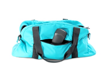 Sport bag with deodorant on white background