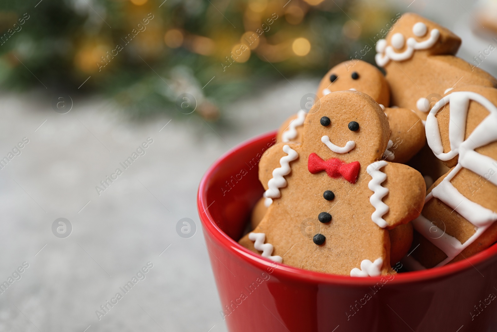 Photo of Tasty homemade Christmas cookies on grey table, closeup view. Space for text