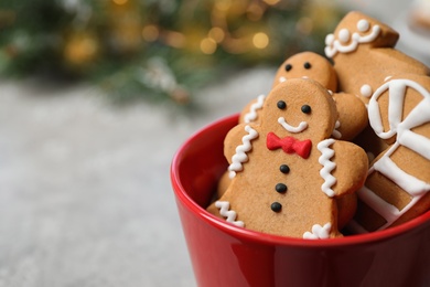 Photo of Tasty homemade Christmas cookies on grey table, closeup view. Space for text