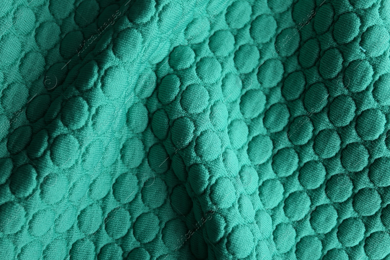 Photo of Textured turquoise fabric as background, closeup view