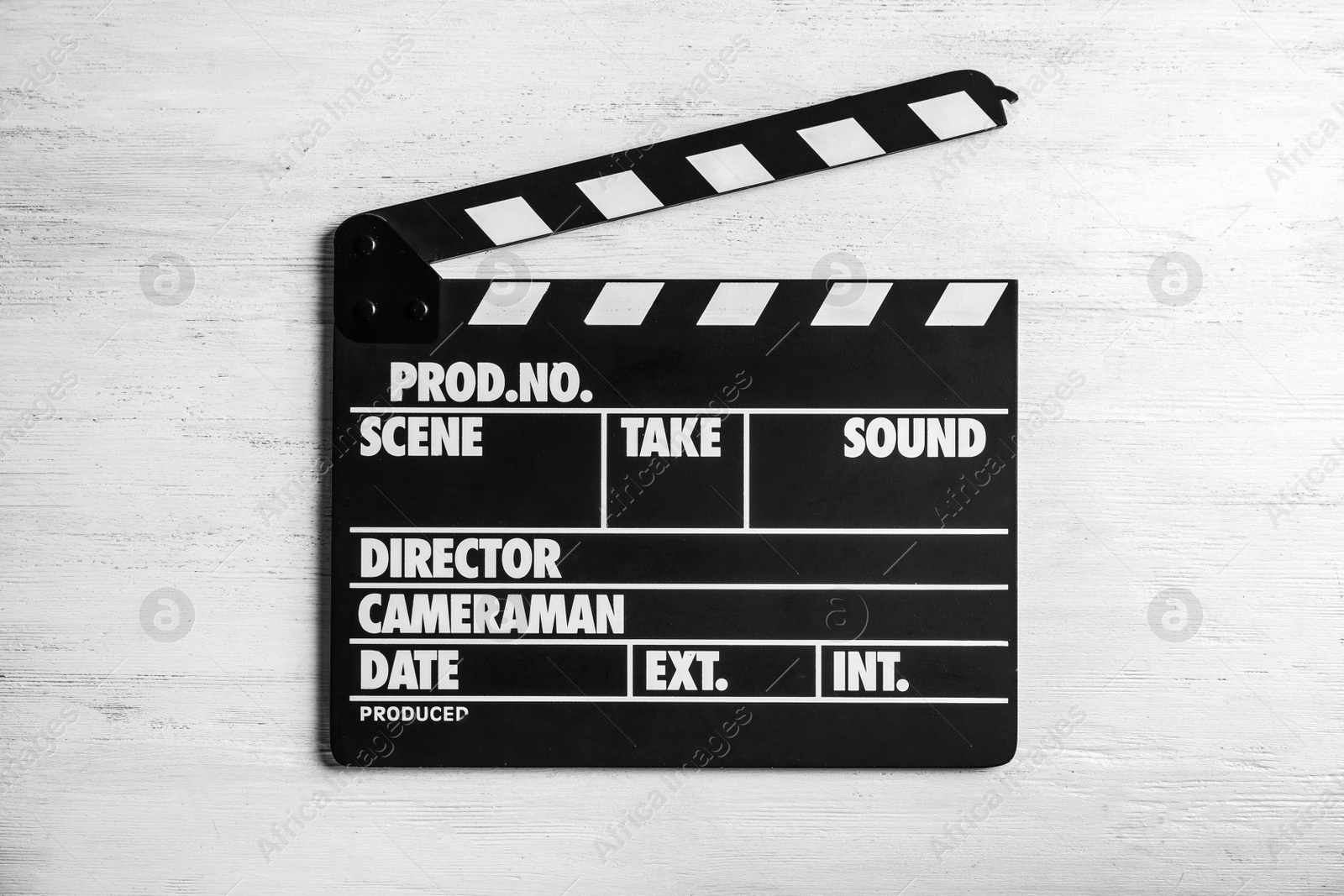 Photo of Clapperboard on wooden background, top view. Cinema production