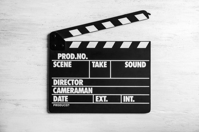 Clapperboard on wooden background, top view. Cinema production