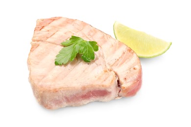 Photo of Delicious tuna steak with parsley and lime isolated on white