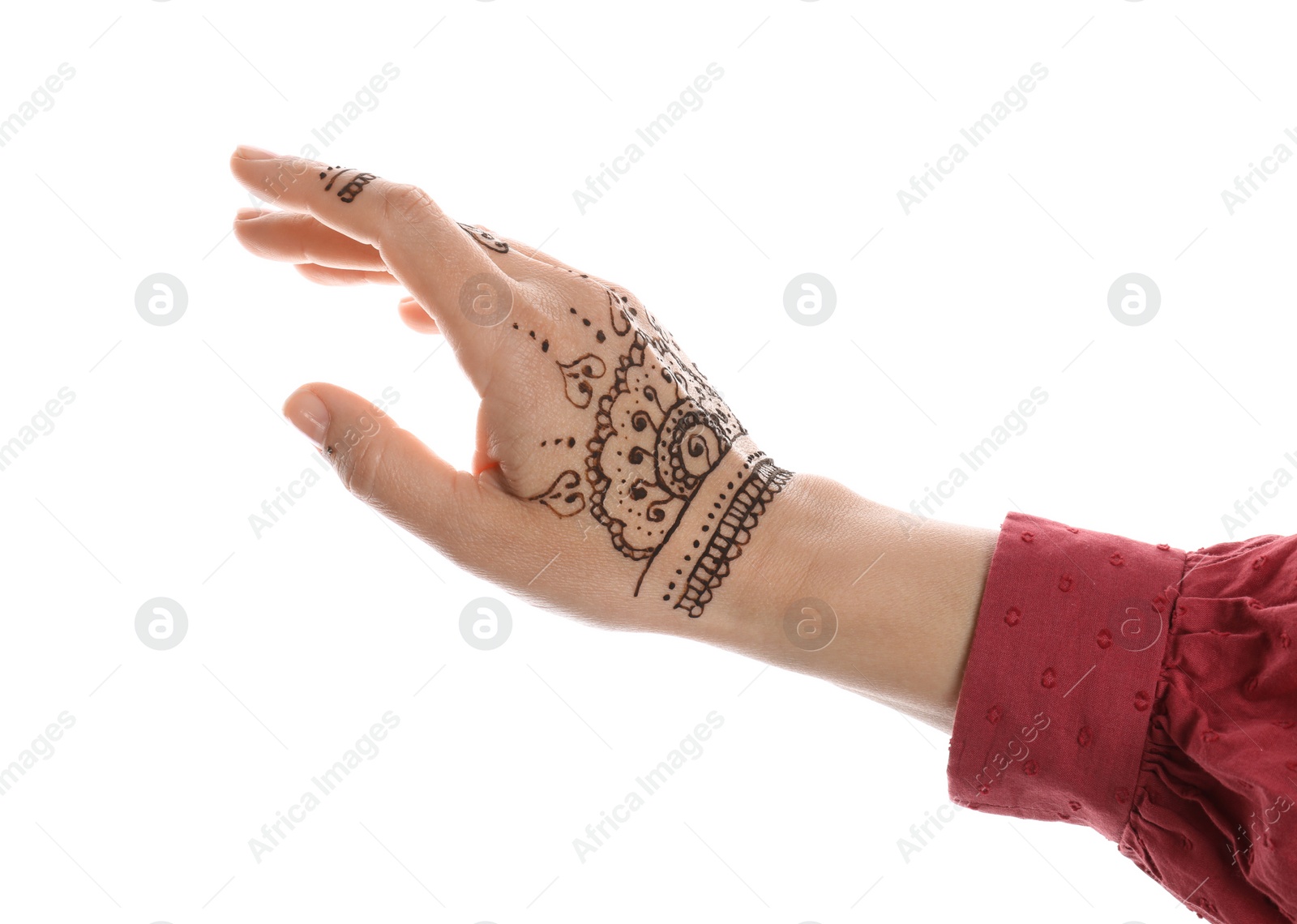 Photo of Woman with beautiful henna tattoo on hand against white background, closeup. Traditional mehndi