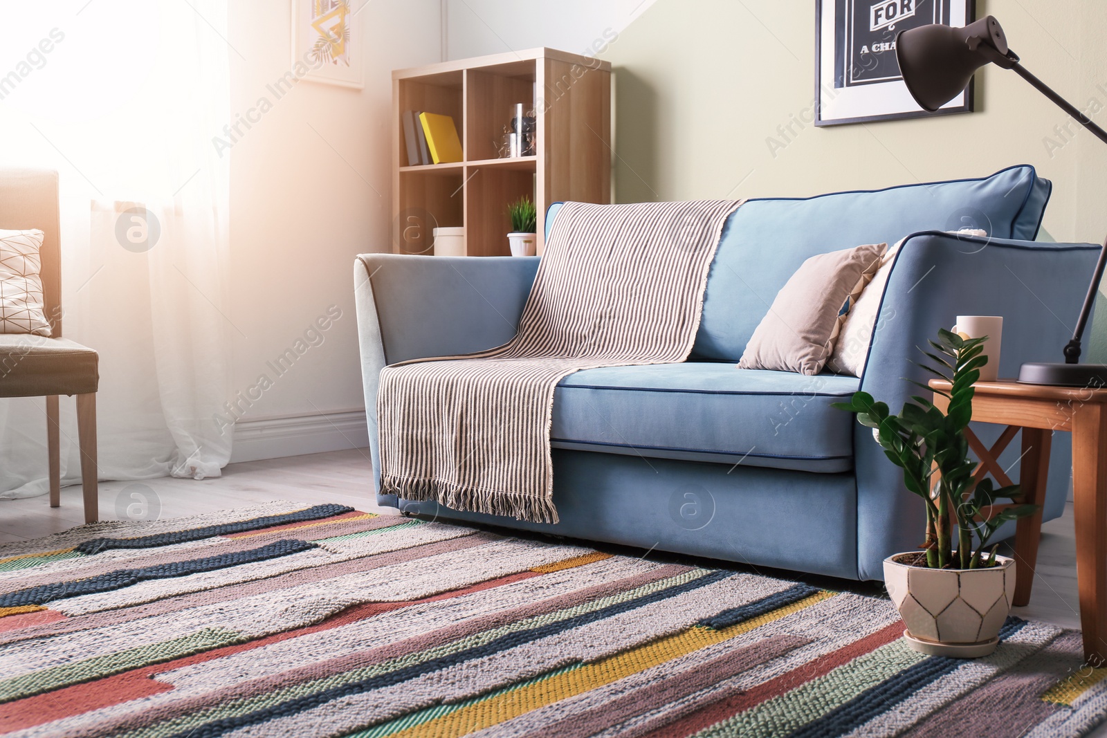 Photo of Stylish living room interior with comfortable sofa