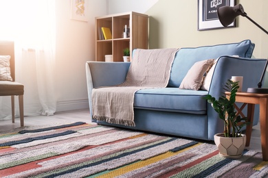 Photo of Stylish living room interior with comfortable sofa