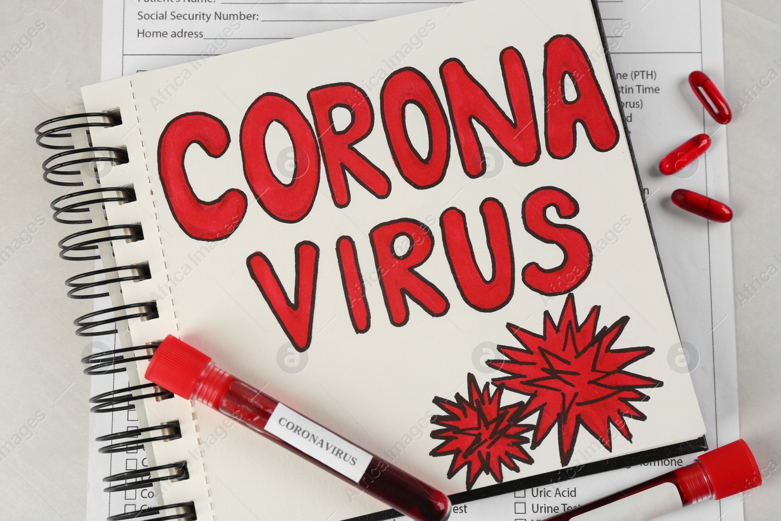 Photo of Notepad with words CORONA VIRUS and blood samples on light background, flat lay