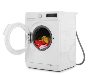 Photo of Modern washing machine with laundry on white background