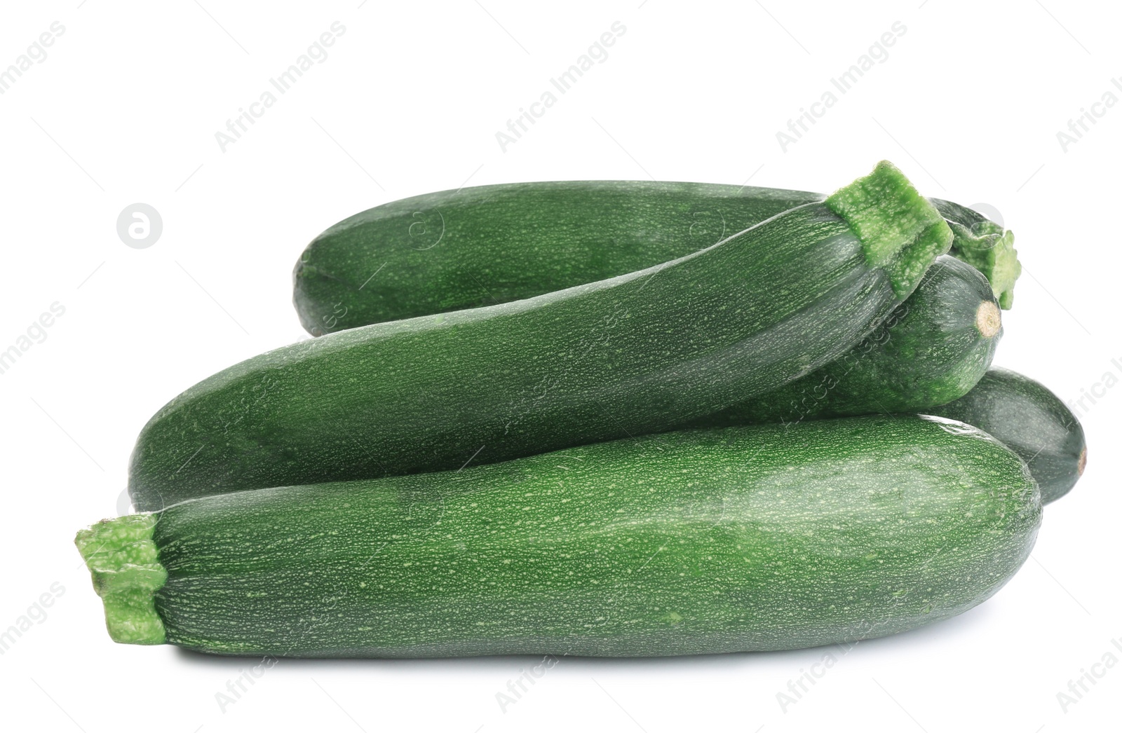 Photo of Fresh ripe green zucchinis isolated on white