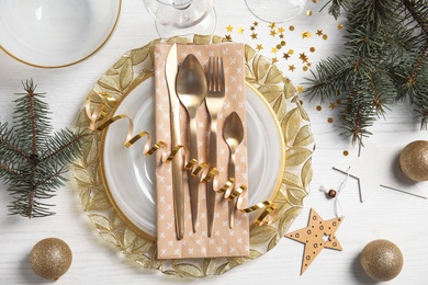 Photo of Elegant table setting on light background, top view. Christmas celebration