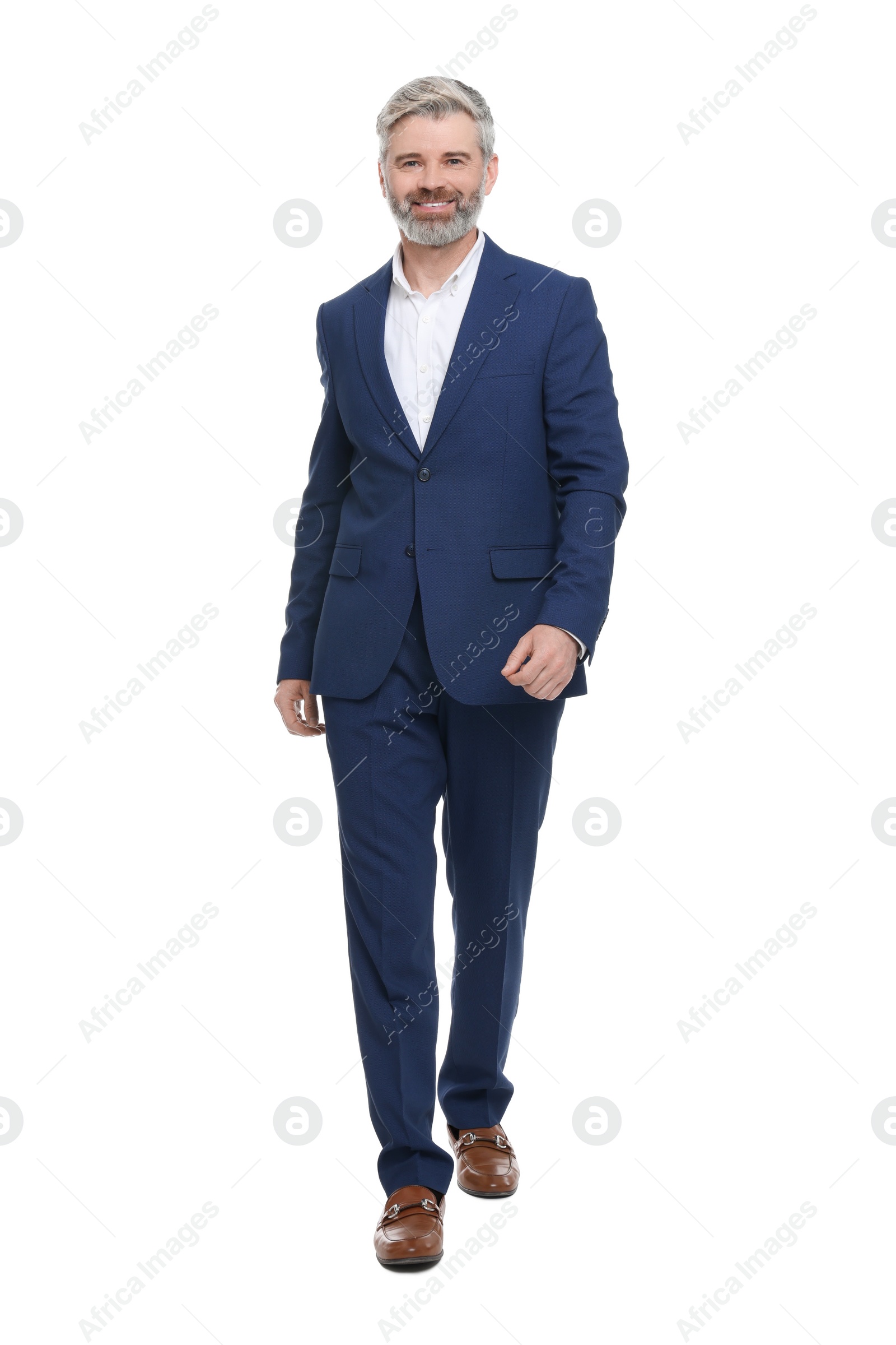 Photo of Mature businessman in stylish clothes posing on white background