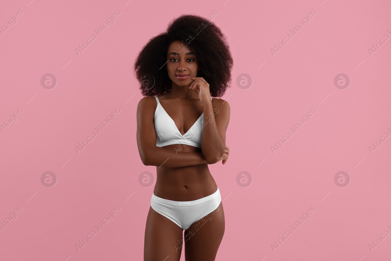 Photo of Beautiful woman in stylish bikini on pink background