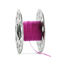 Metal spool of bright pink sewing thread isolated on white