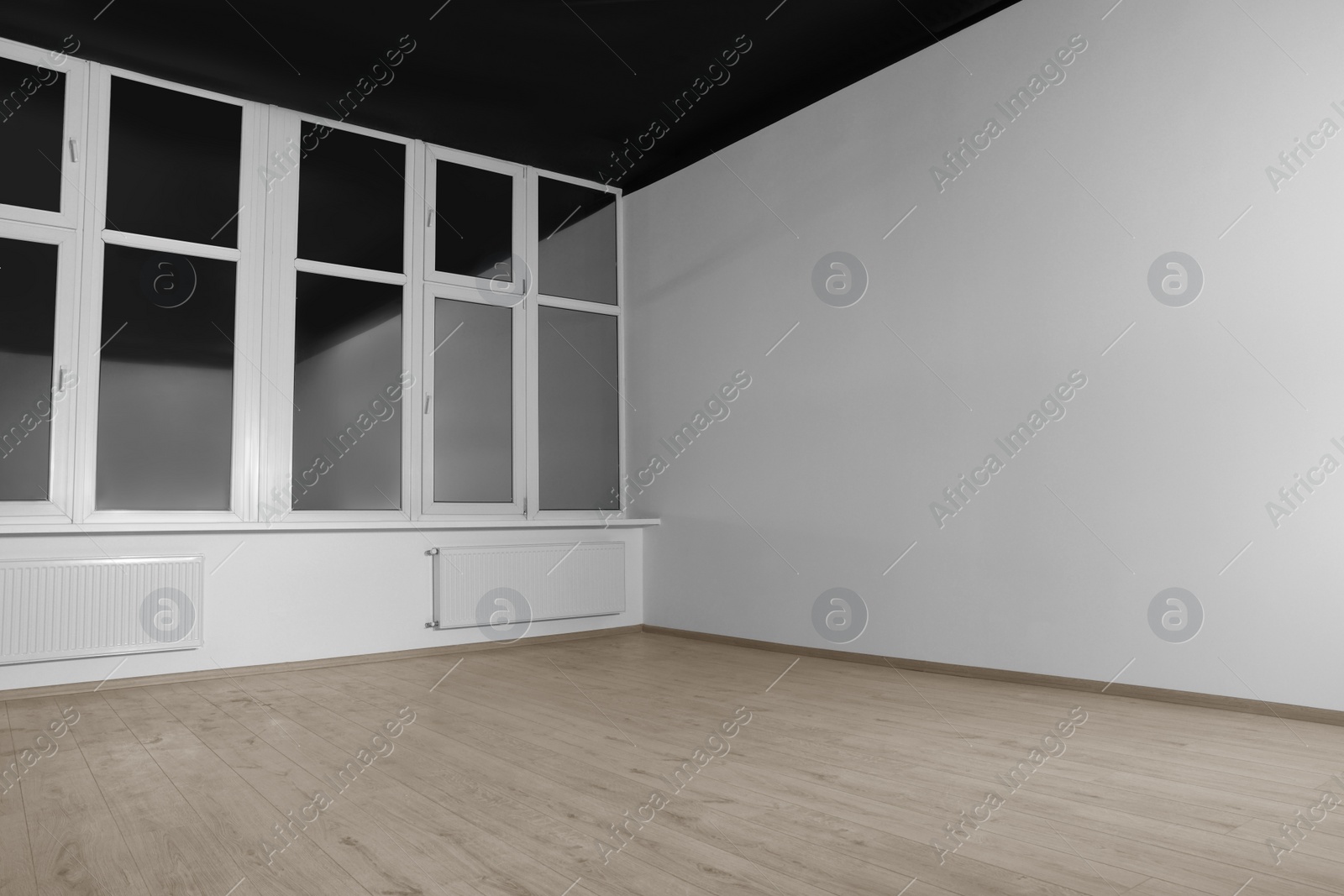 Photo of New empty room with clean windows and white walls