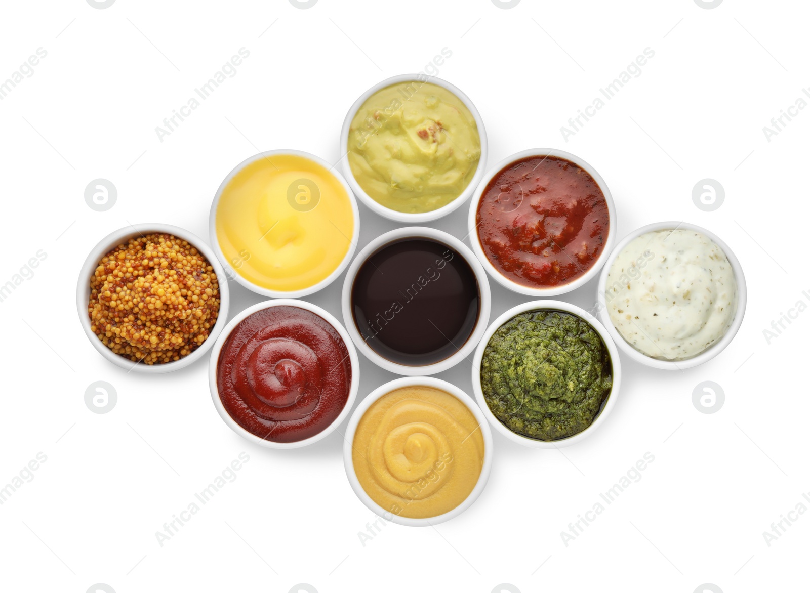 Photo of Many different sauces in bowls on white background, top view