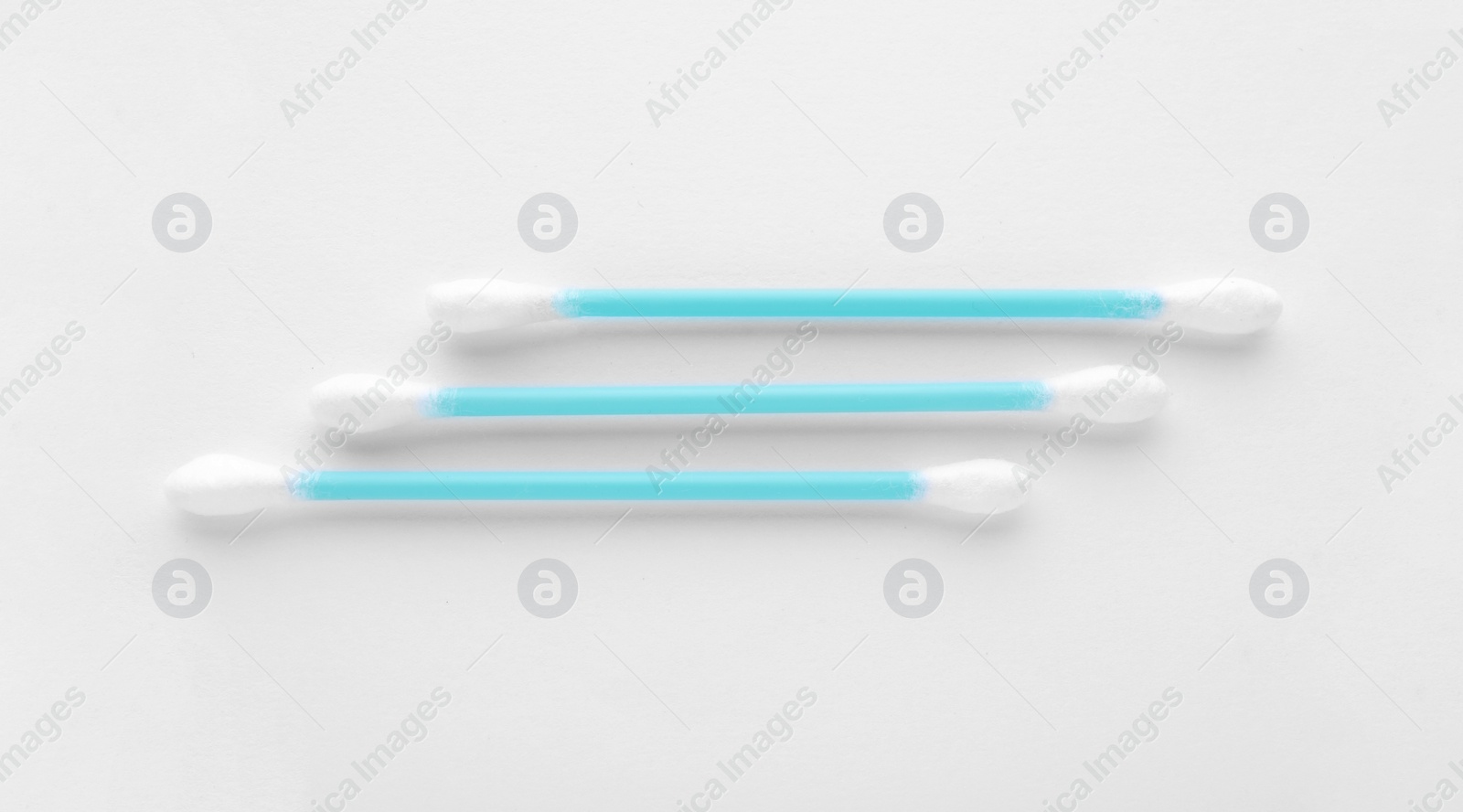 Photo of Clean cotton buds on white background, top view. Hygienic accessory