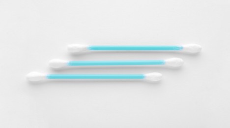 Clean cotton buds on white background, top view. Hygienic accessory