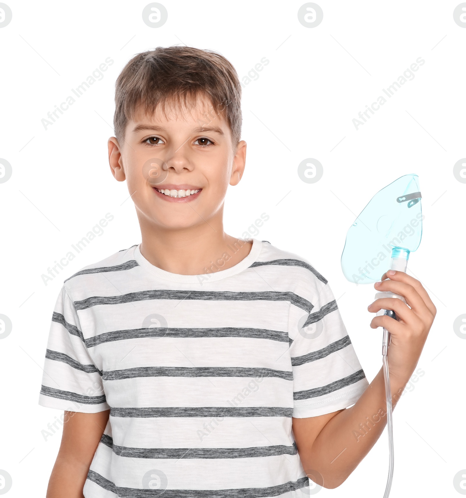 Photo of Boy holding nebulizer for inhalation on white background. Space for text