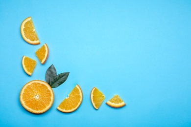 Photo of Composition with fresh oranges and space for text on color background, flat lay