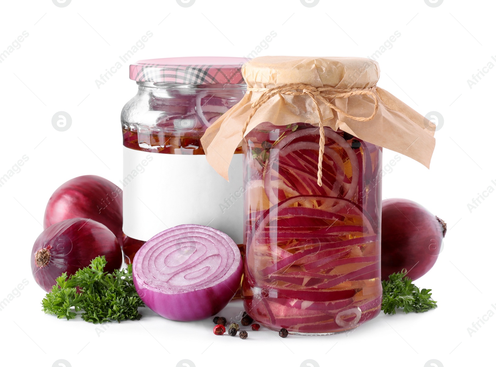 Photo of Jars of pickled onions isolated on white