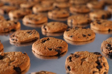 Many delicious cookies on production line, closeup