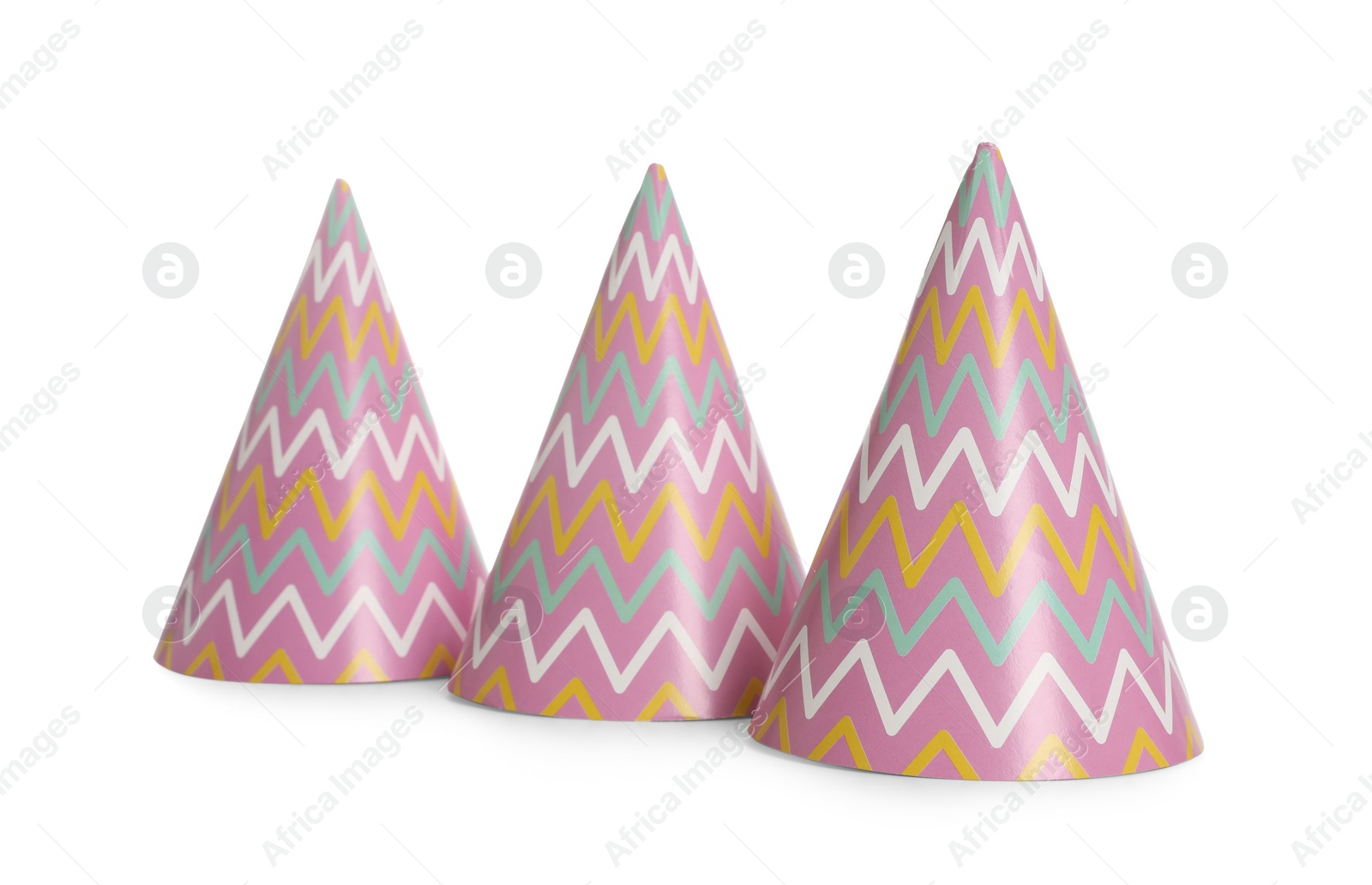 Photo of Bright birthday party hats on white background