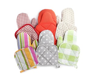Photo of Oven gloves and potholders for hot dishes on white background, top view