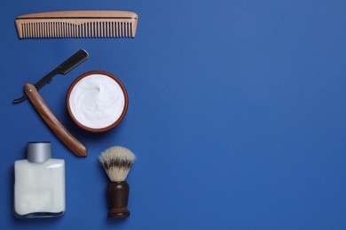 Photo of Flat lay composition with men's shaving accessories on blue background, space for text