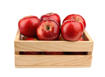 Wooden crate of ripe juicy red apples on white background