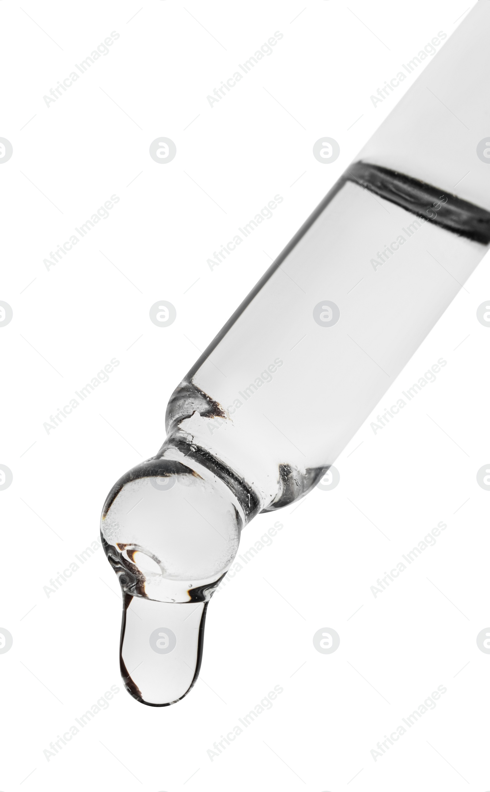 Photo of Dripping clear facial serum from pipette on white background, closeup