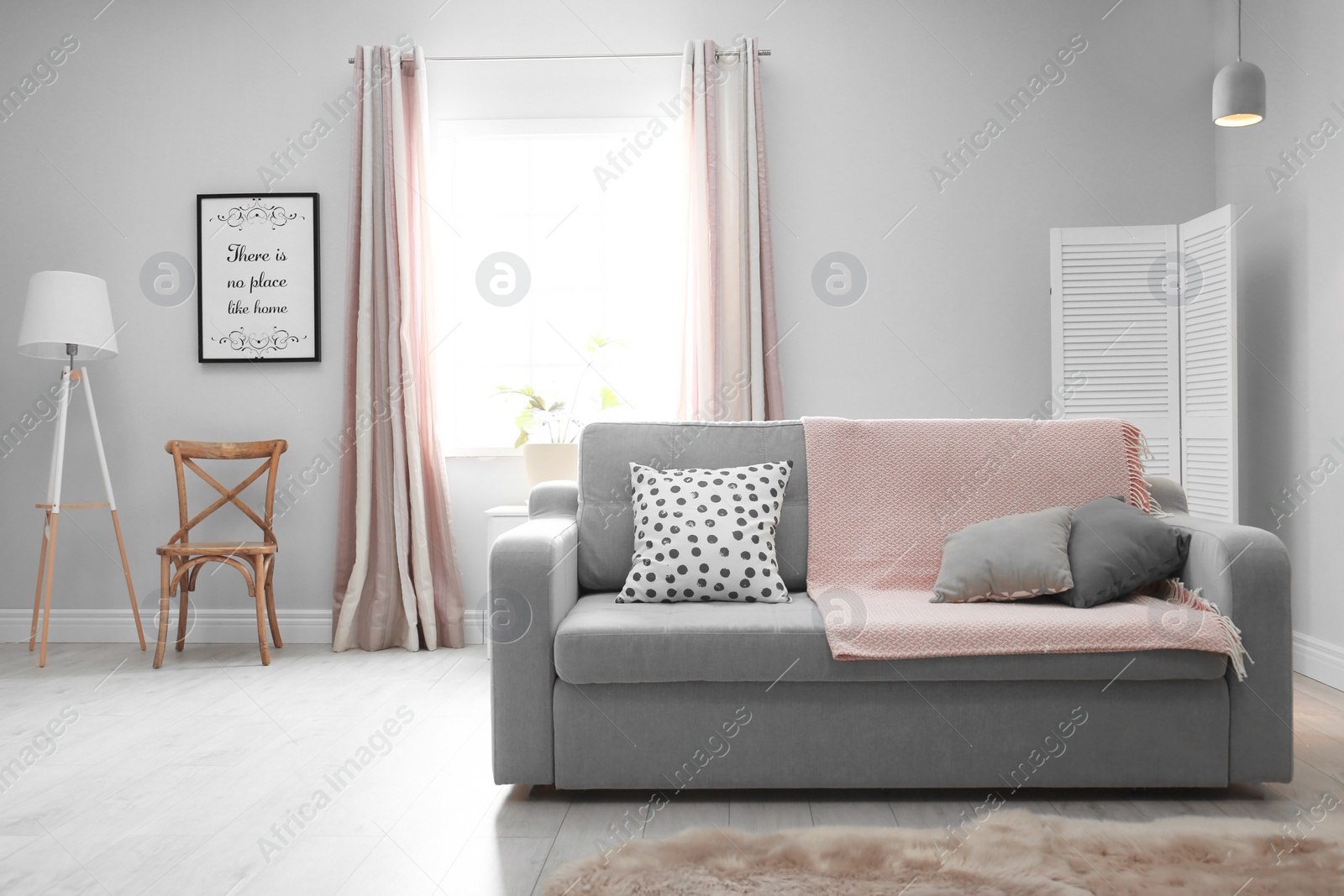 Photo of Stylish living room interior with comfortable couch