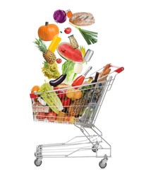 Image of Market assortment. Different products falling into shopping cart on white background
