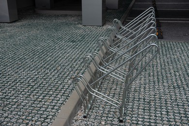 Photo of Empty metal parking rack for bicycles outdoors