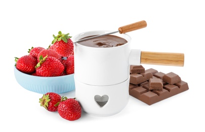 Fondue pot with chocolate and fresh strawberries on white background