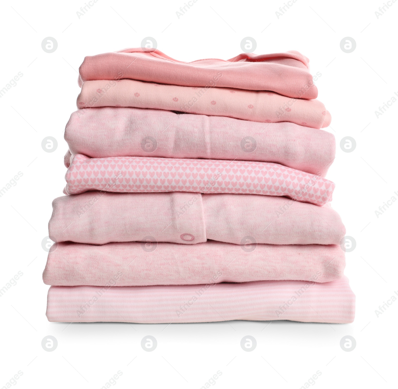 Photo of Stack of baby girl's clothes on white background