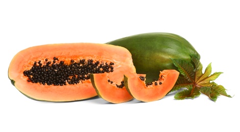 Fresh juicy ripe papayas with leaf on white background