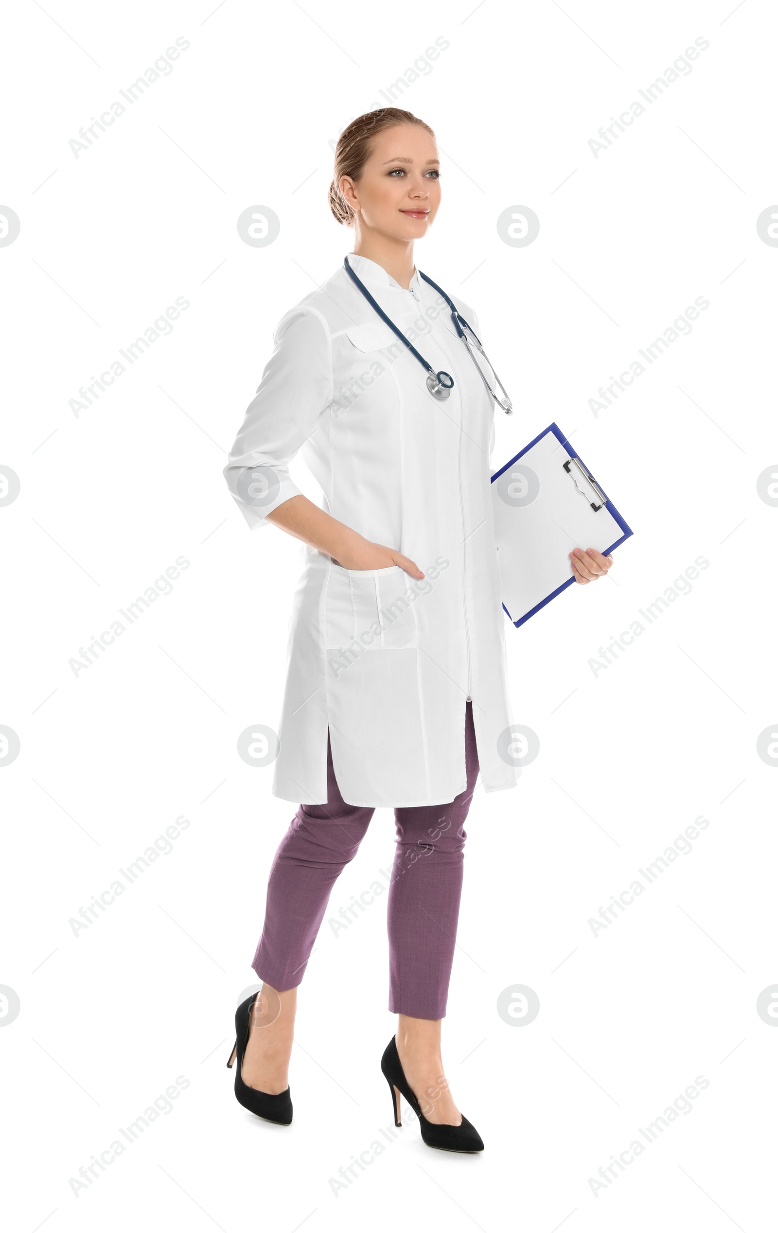 Photo of Full length portrait of medical doctor with clipboard and stethoscope isolated on white