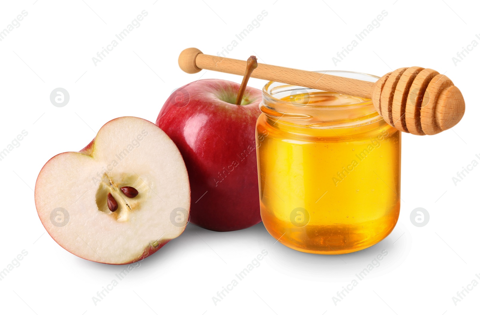 Image of Honey in glass jar, apples and dipper isolated on white