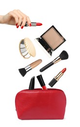Image of Woman holding red lipstick on white background, closeup. Other makeup products falling into red cosmetic bag