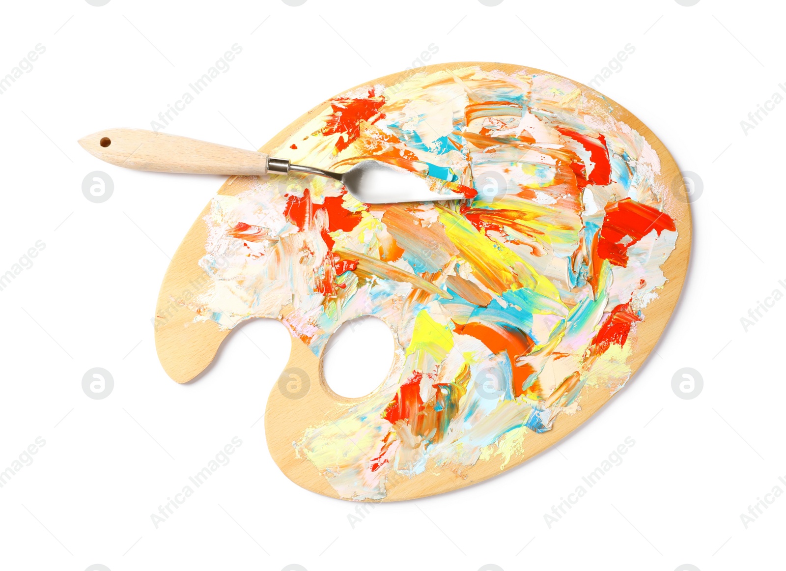 Photo of Dirty wooden artist's palette with painting knife isolated on white, top view