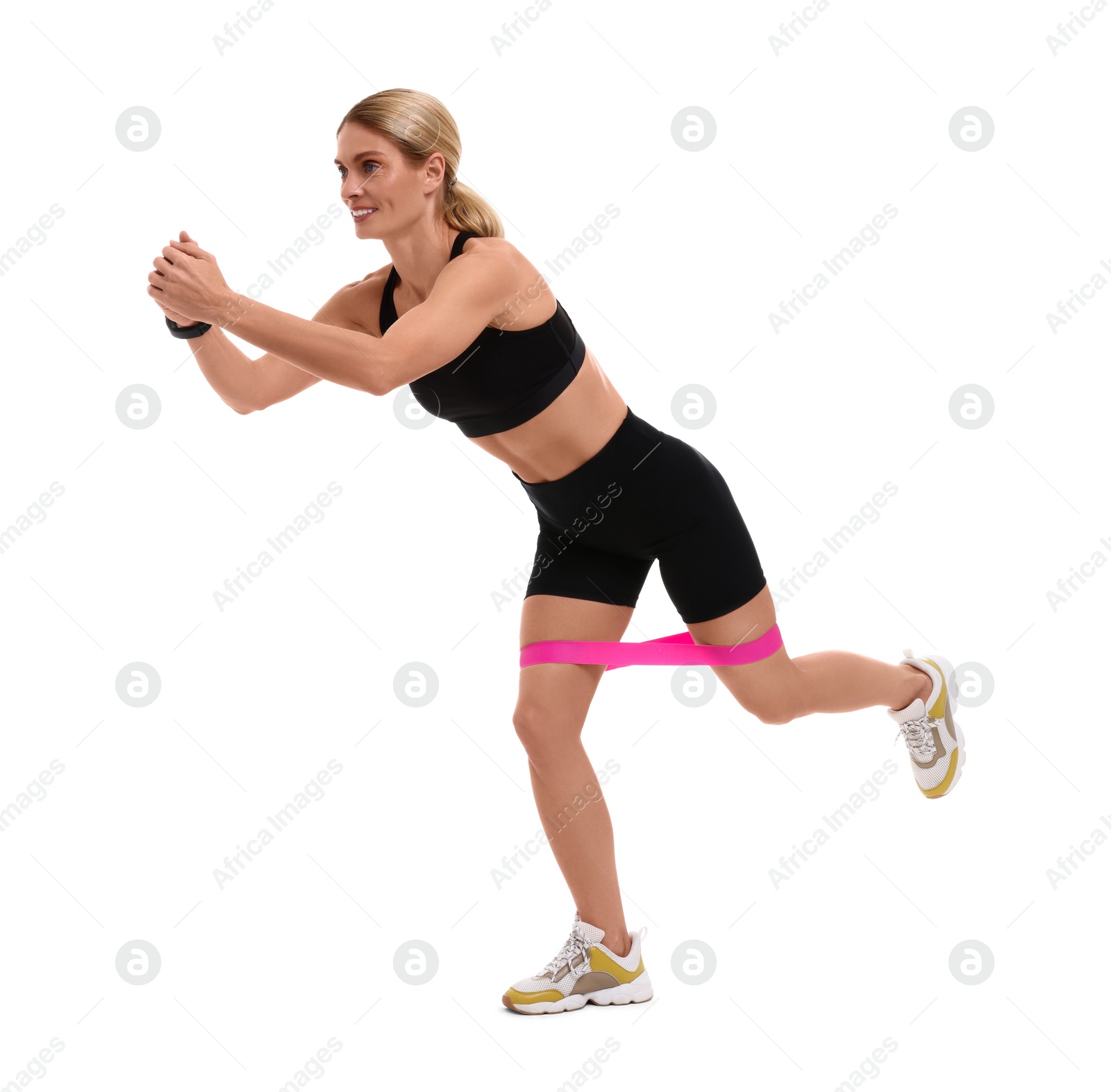 Photo of Woman exercising with elastic resistance band on white background