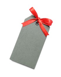 Blank grey gift tag with red satin ribbon on white background, top view. Space for design