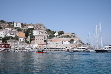 Photo of Beautiful view of sea with boats and coastal city