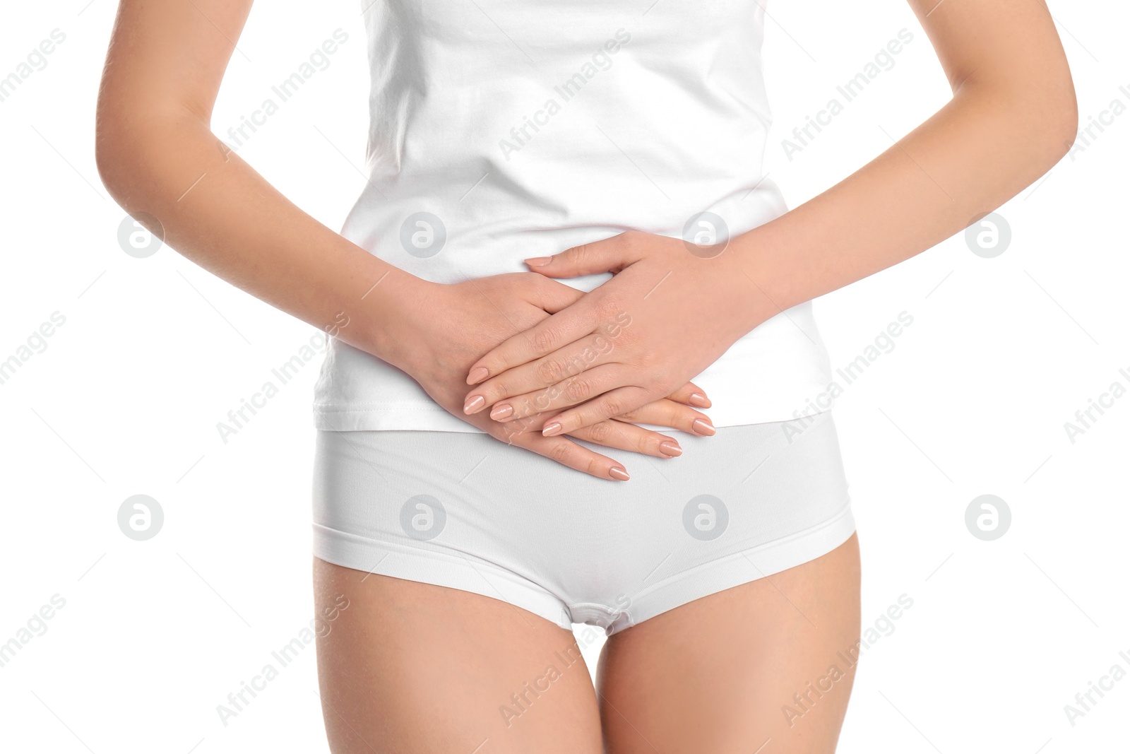 Photo of Young woman holding hands near underwear on white background. Gynecology