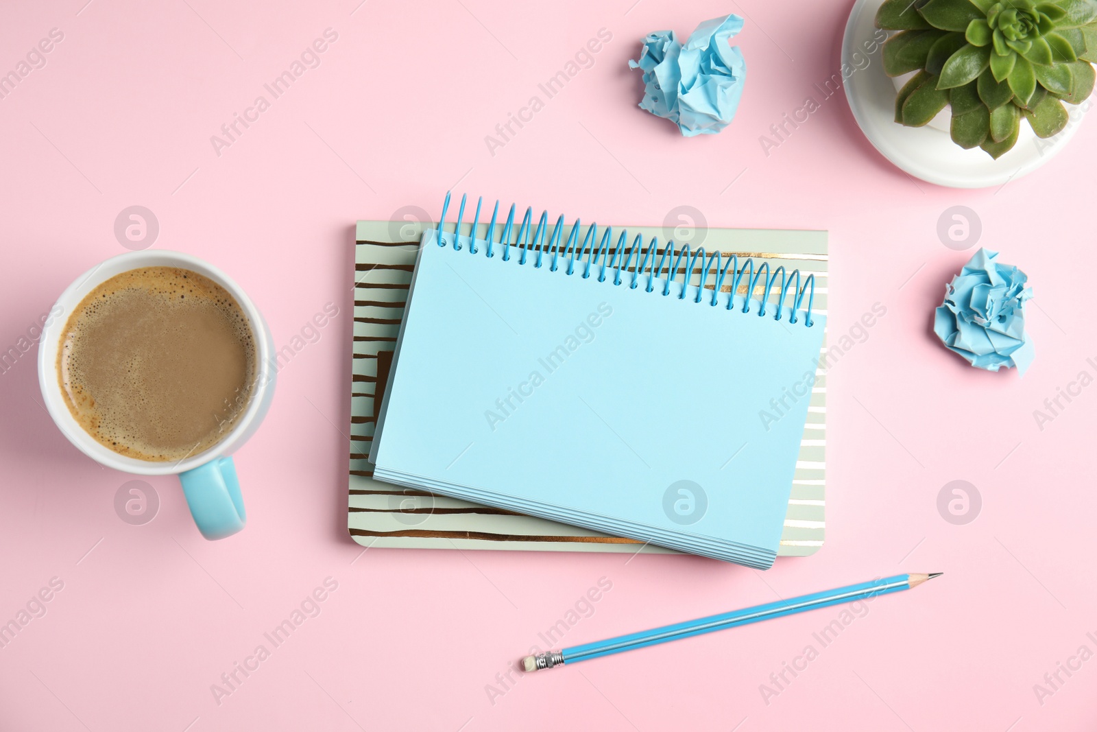 Photo of Flat lay composition with notebooks and coffee on color background