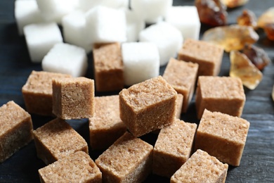 Brown sugar on wooden background, closeup