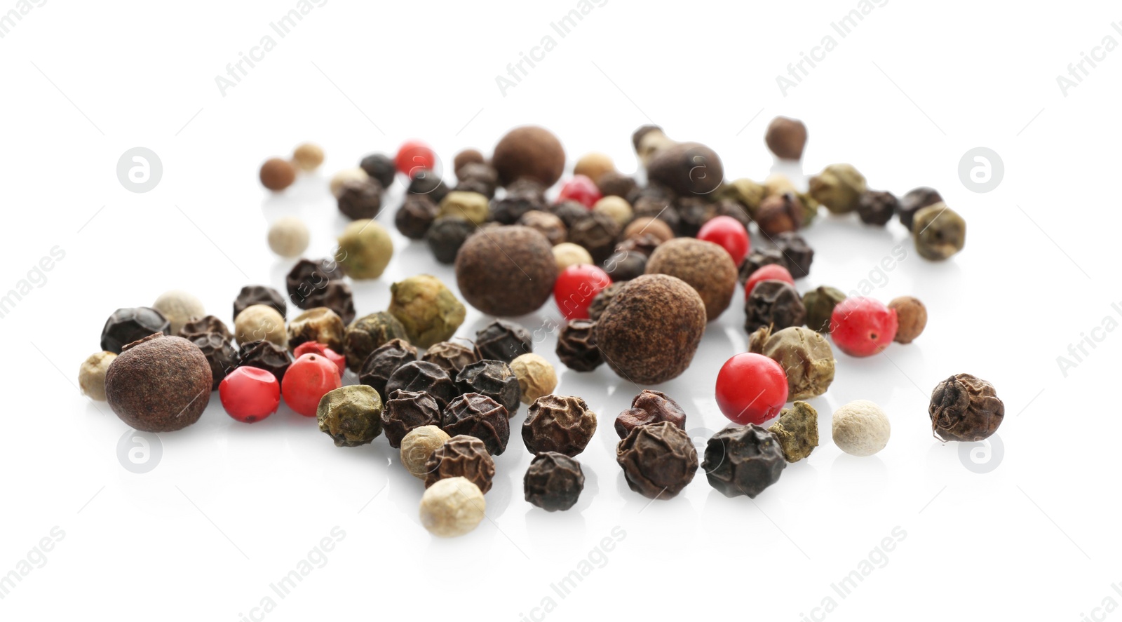 Photo of Mix of different pepper grains on white background. Natural spice
