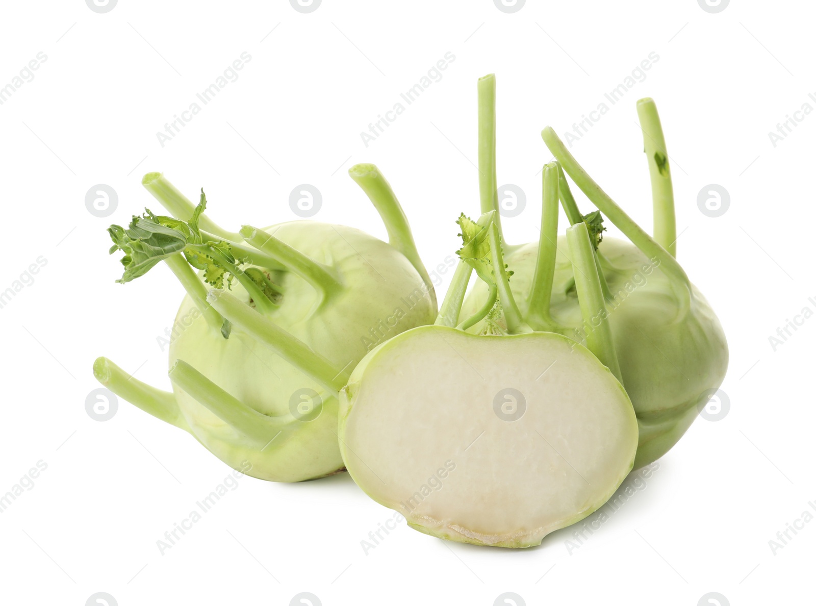 Photo of Whole and cut kohlrabi plants on white background