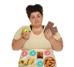 Overweight woman with images of different unhealthy food on her belly against white background