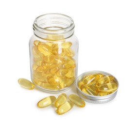 Photo of Bottle and pile of softgel capsules isolated on white